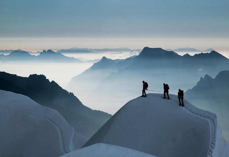 Climbing Team On A Snowy Ridge Photograph by Buena Vista Images