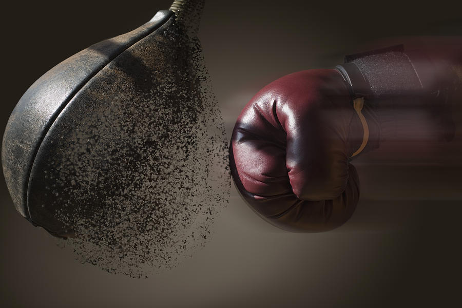 Close up boxer and punch bag with blurred motion Photograph by REB Images