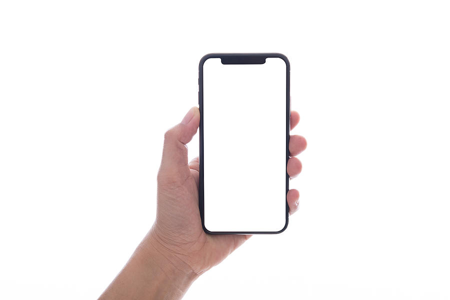 Close Up Hand Hold Phone Isolated On White, Mock-up Smartphone White Color Blank Screen Photograph by Issarawat Tattong