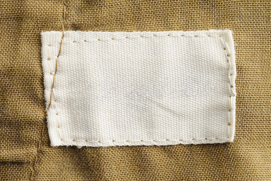 Close-up of a blank white clothing label Photograph by Kyoshino