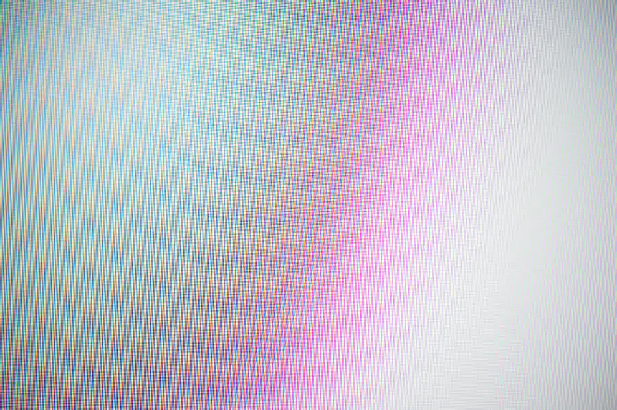 Close-up of a colorful moire pattern on a computer screen. Photograph by Oleksandra Korobova