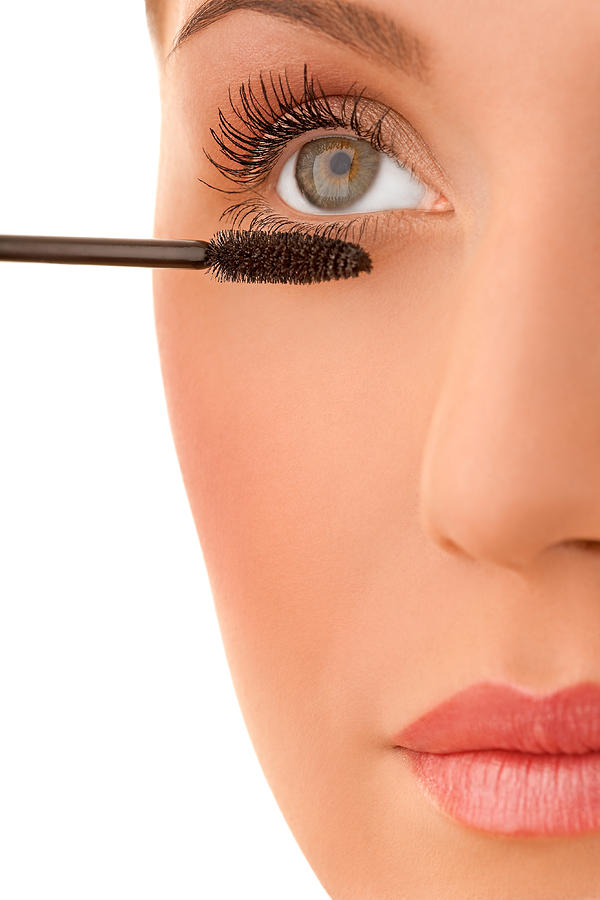 Close-up of a female applying make-up Photograph by ChristopherBernard