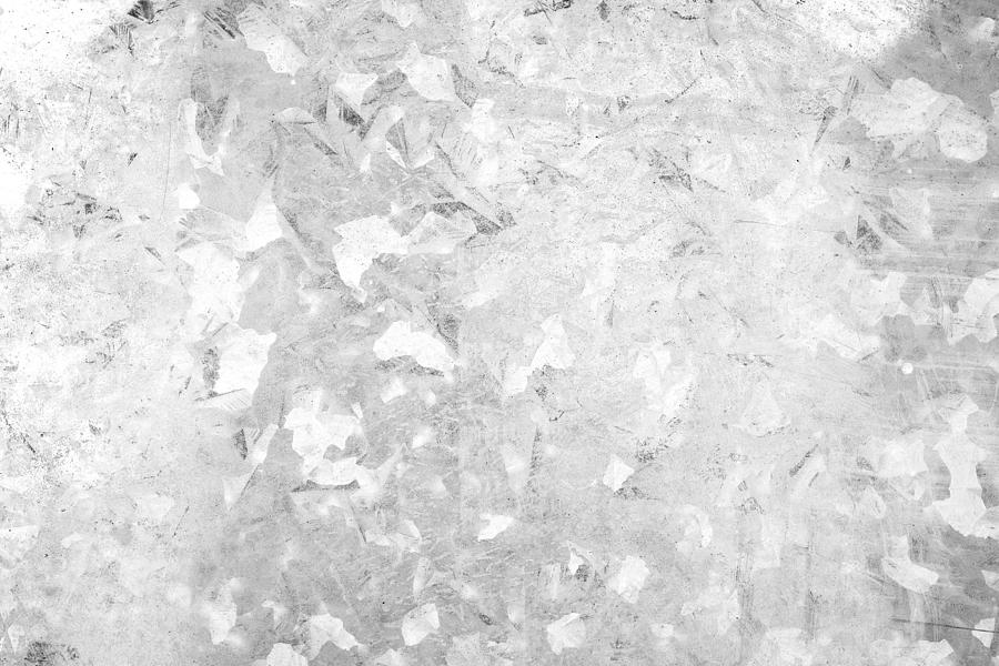 Close-up of a galvanized gray zinc plate texture background in black&white. Photograph by Tuomas Lehtinen