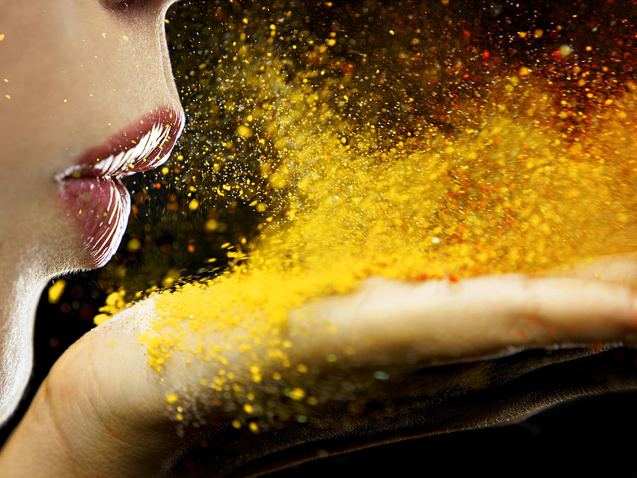 Close Up Of A Mouth Blowing On Yellow Dust Photograph by Edgardo Contreras