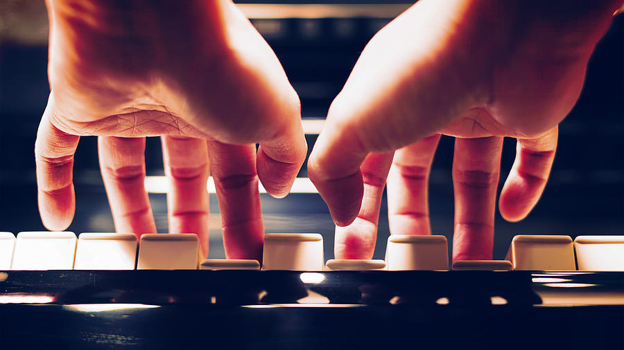 Close-up of a womans hands playing the piano Photograph by ChatchaiWA