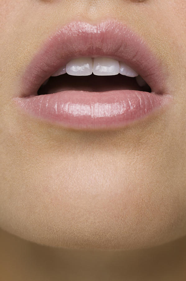 Close-up of a young woman with her mouth open Photograph by Digital Vision