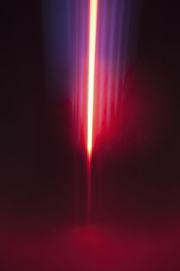 Close-up of abstract red and blue light trails against black background Photograph by Ralf Hiemisch