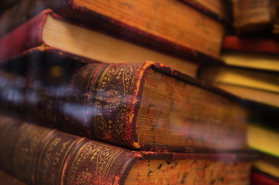 Close Up Of Antique Books In Leather By Tetra Images