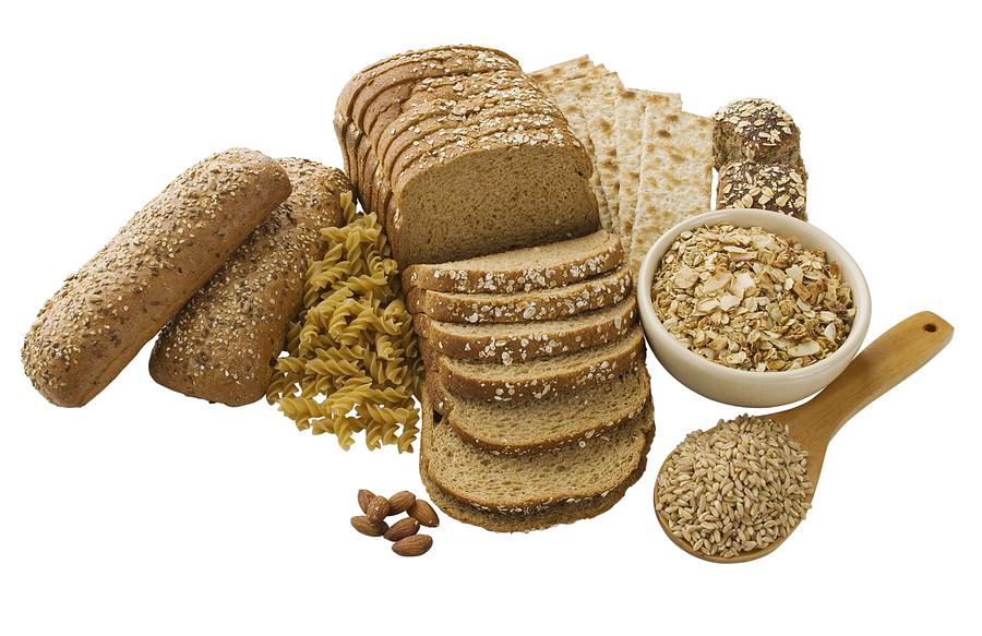 Close up of assorted grains and bread Photograph by Tetra Images
