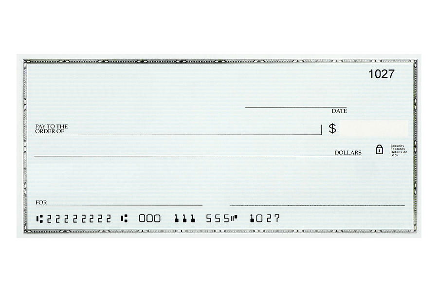 Close-up of blank bank check sample against white background Photograph by Oddphoto
