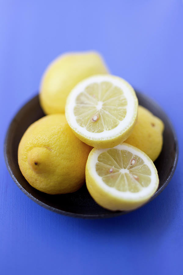 Lemon Photograph - Close Up Of Bowl Of Lemons by Brigitte Sporrer