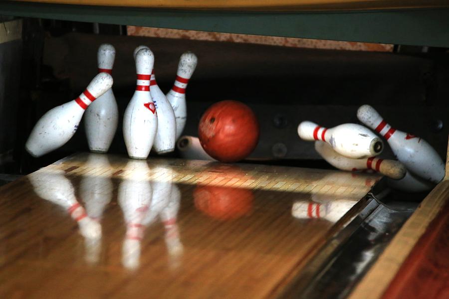 Close up of Bowling Ball hitting the Pins at a Bowling Alley Photograph by Douglas Sacha