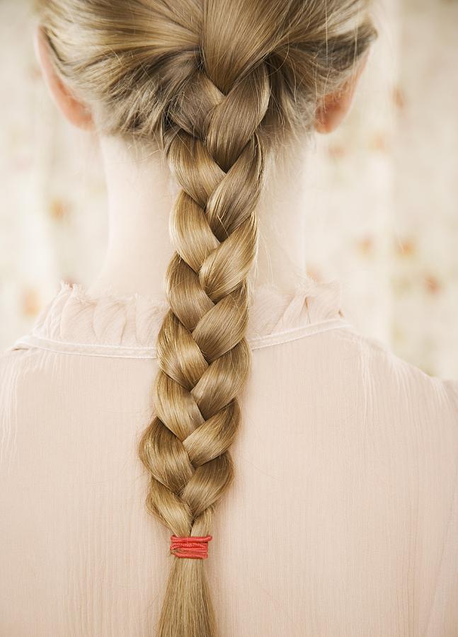 Close up of braid down a woman?s back Photograph by Tetra Images