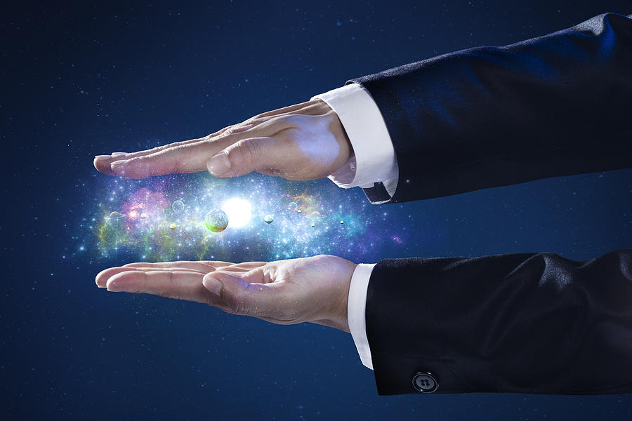 Close Up Of Businessmans Hand Holding A Galaxy Photograph by Paper Boat Creative