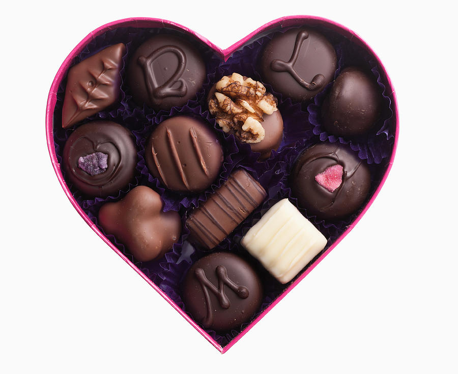 Close up of chocolates in heart-shape box Photograph by Robert Daly