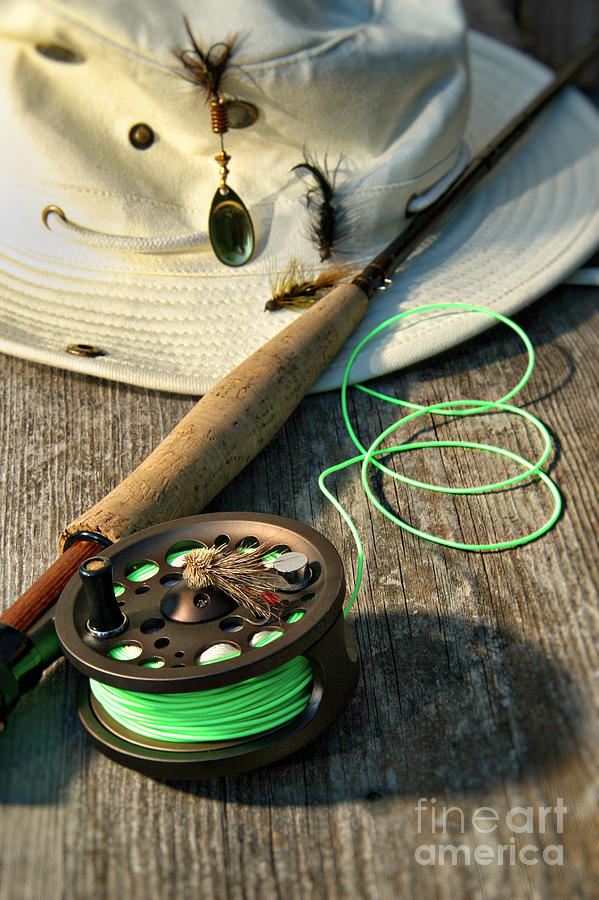 Fish Photograph - Close-up of fly-fishing reel and rod with hat by Sandra Cunningham