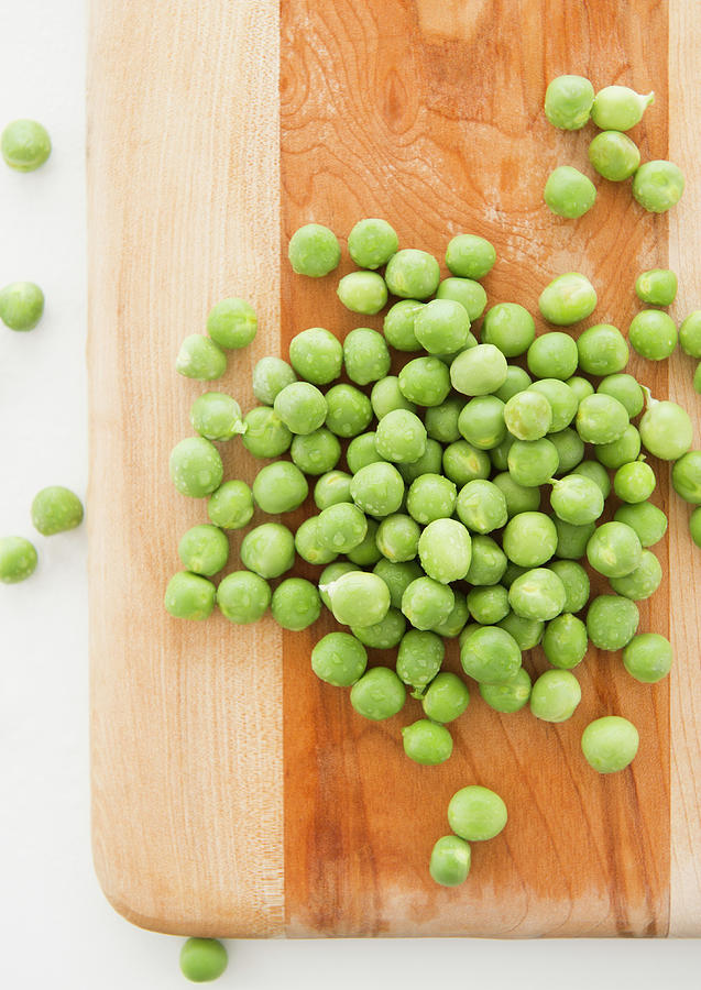 Close Up Of Green Peas On Cutting Photograph by Jamie Grill
