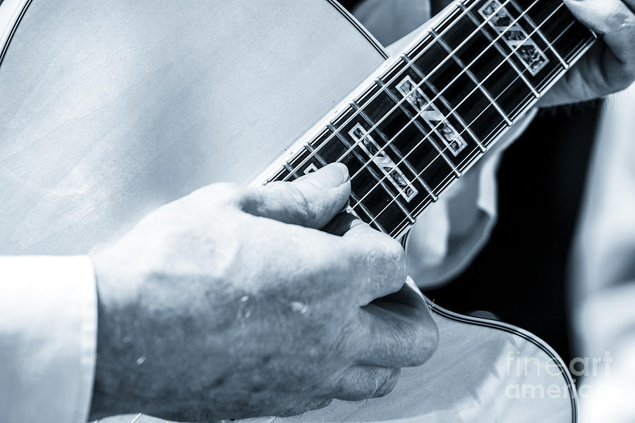 Close Up Of Guitarist Hand Strumming Photograph by Peter Noyce