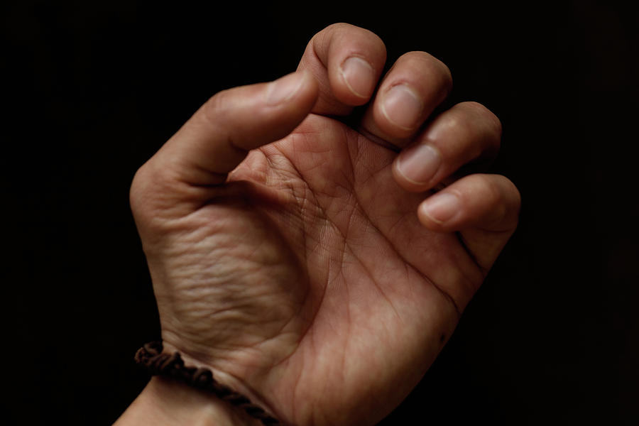 Close Up Of Hand With Dark Background Photograph by Yuko Yamada