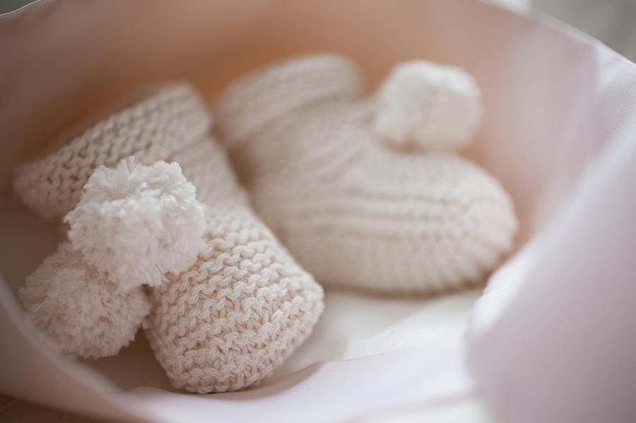 Close up of knit baby booties Photograph by Tom Merton