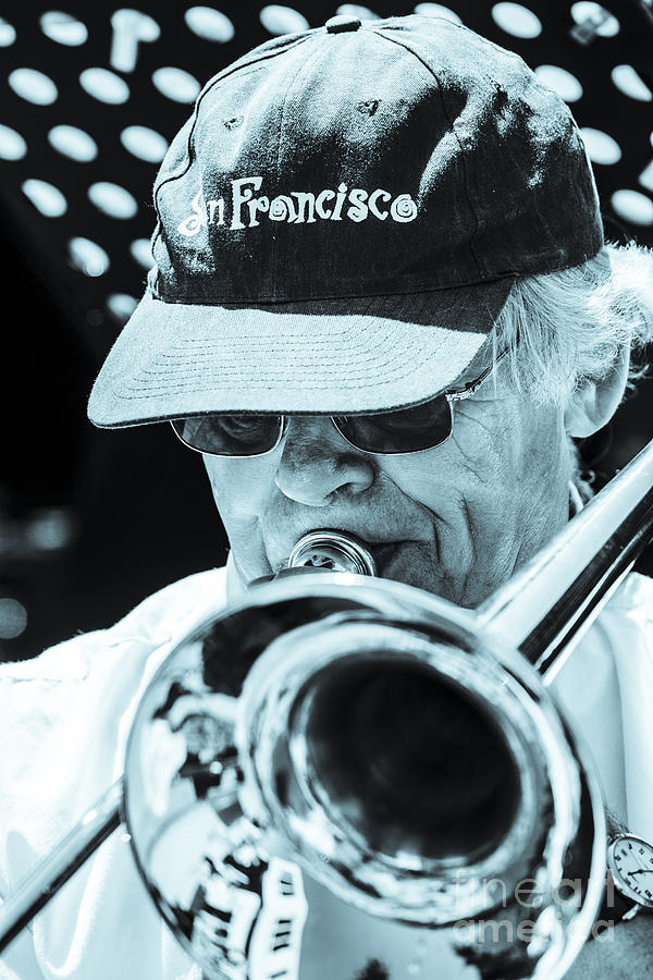 Close Up Of Male Trombone Player In Baseball Cap Photograph by Peter Noyce