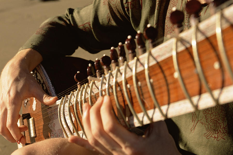 Close-up of man playing sitar Photograph by Keith Berson