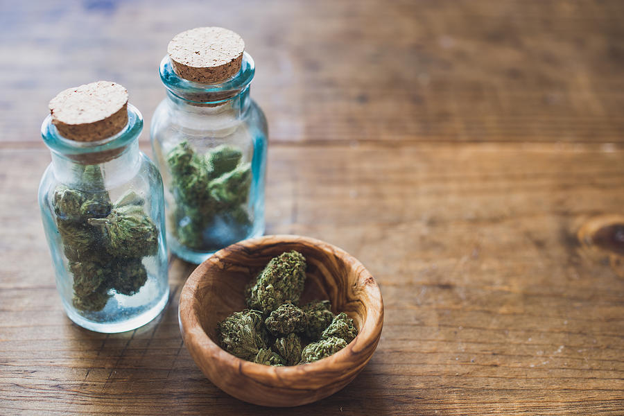 Close-Up Of Marijuana In Jar On Table Photograph by Seth Ryan / EyeEm