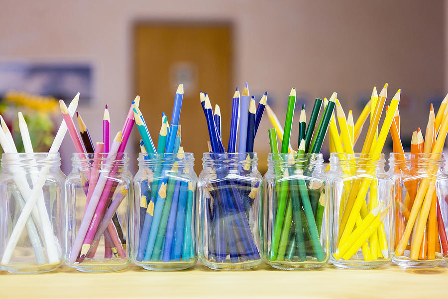 Close up of multicolor pencils organized in jars Photograph by Marc Romanelli