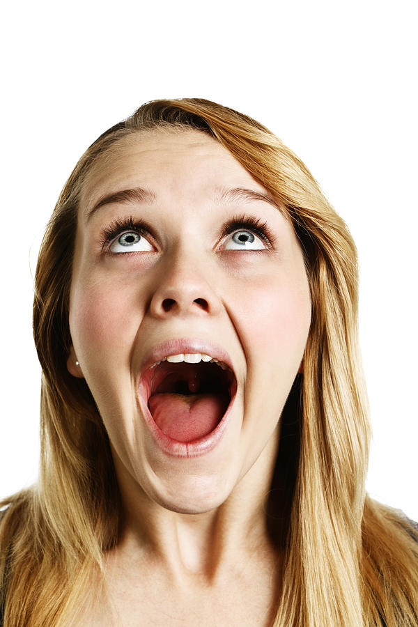 Close-up of overjoyed young blonde woman looking up Photograph by Clicknique
