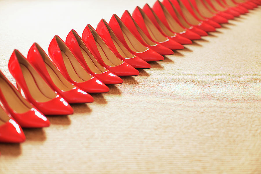 Close Up Of Red Shoes In A Row Photograph by Anthony Harvie