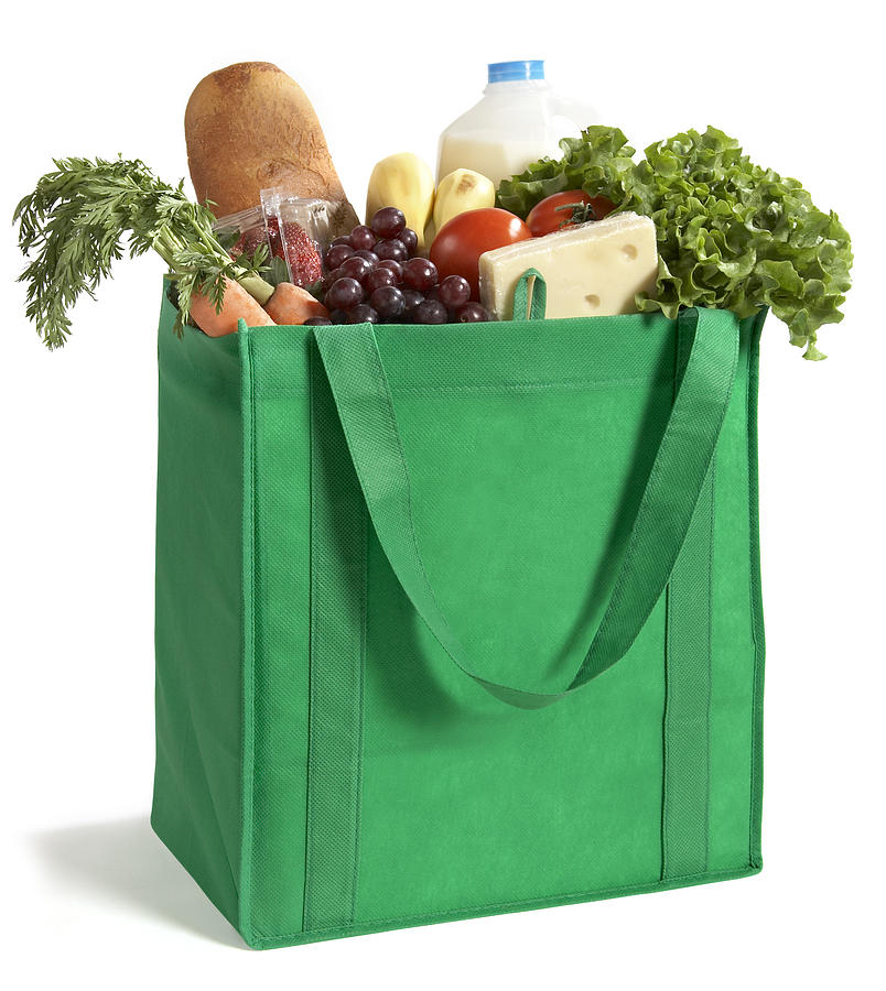 Close-up of reusable grocery bag filled with fresh produce Photograph by Janine Lamontagne