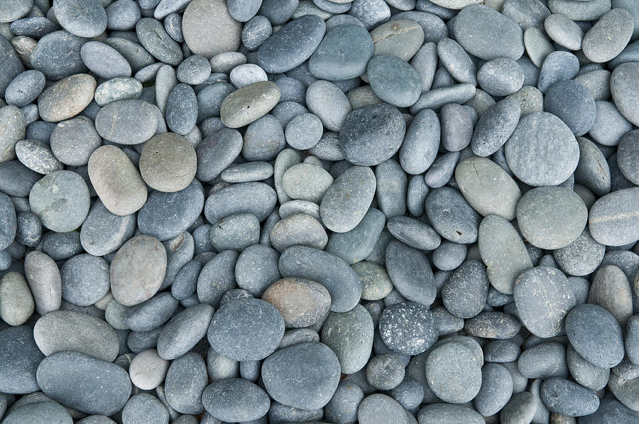 Close up of rounded grey river rocks Photograph by Spiderplay