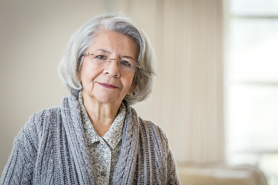 Close up of serious face of older Hispanic woman Photograph by Terry Vine