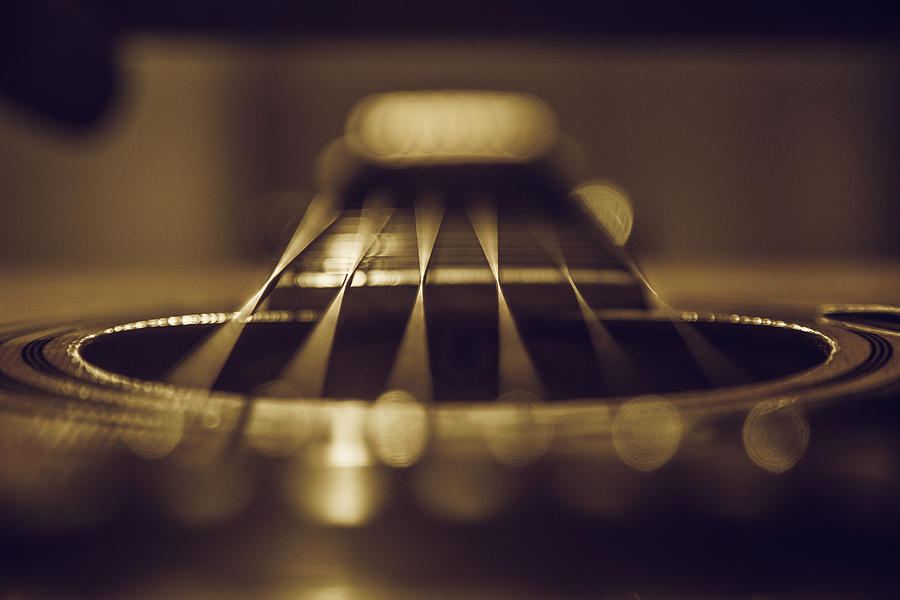 Close up of six string acoustic guitar Photograph by David Trood