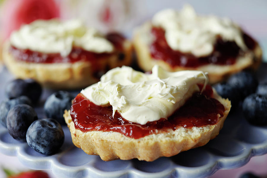 Close Up Of Sliced Scone With Jam Photograph by Debby Lewis-harrison