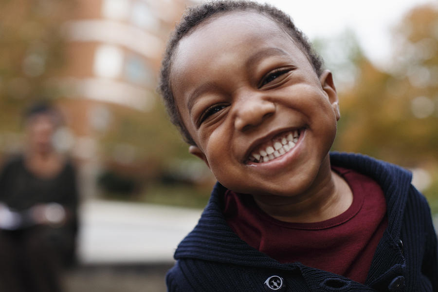 Close up of smiling face of African American boy Photograph by Roberto Westbrook