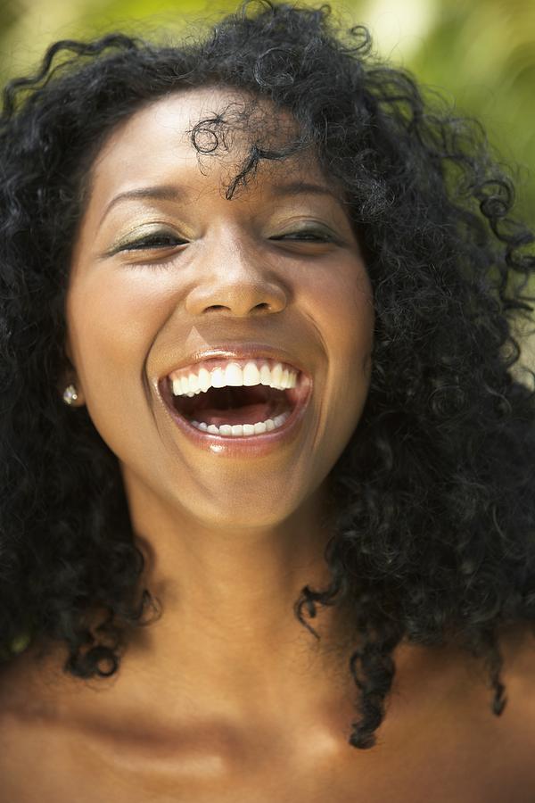 Close up of South American woman laughing Photograph by Jon Feingersh Photography Inc