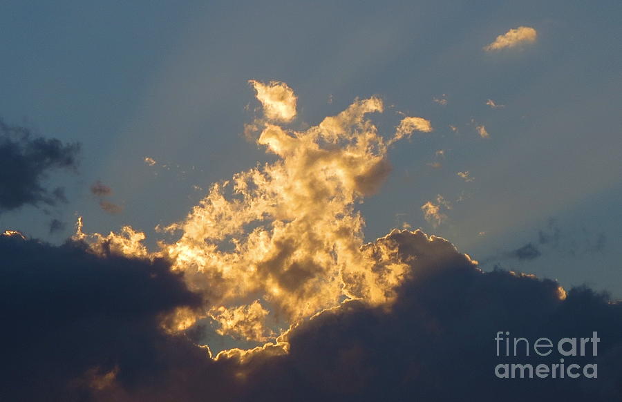 Close Up of Suns rays piercing the cloud Photograph by Robert Birkenes