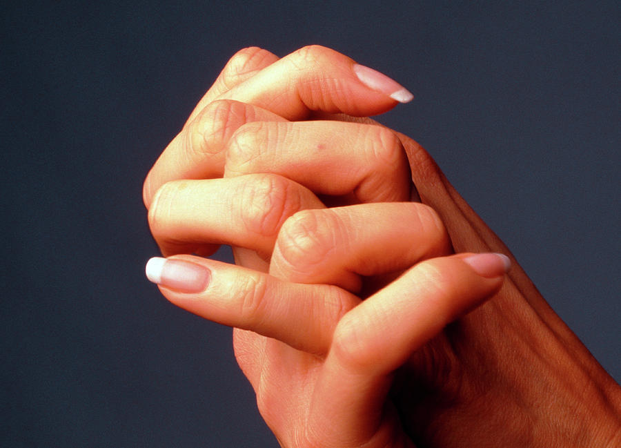 Close-up Of The Interlocked Fingers Of A Woman Photograph by Phil Jude ...