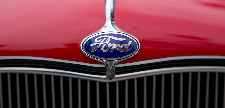 Transportation Photograph - Close-up Of The Logo Of Fords Car by Panoramic Images