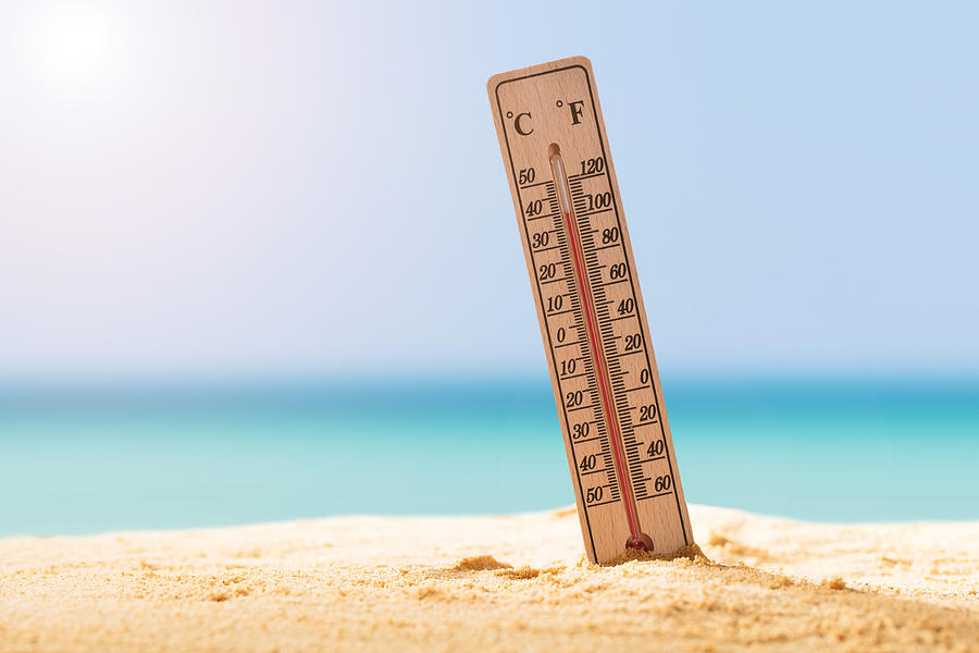Close-up Of Thermometer On Sand Photograph by AndreyPopov