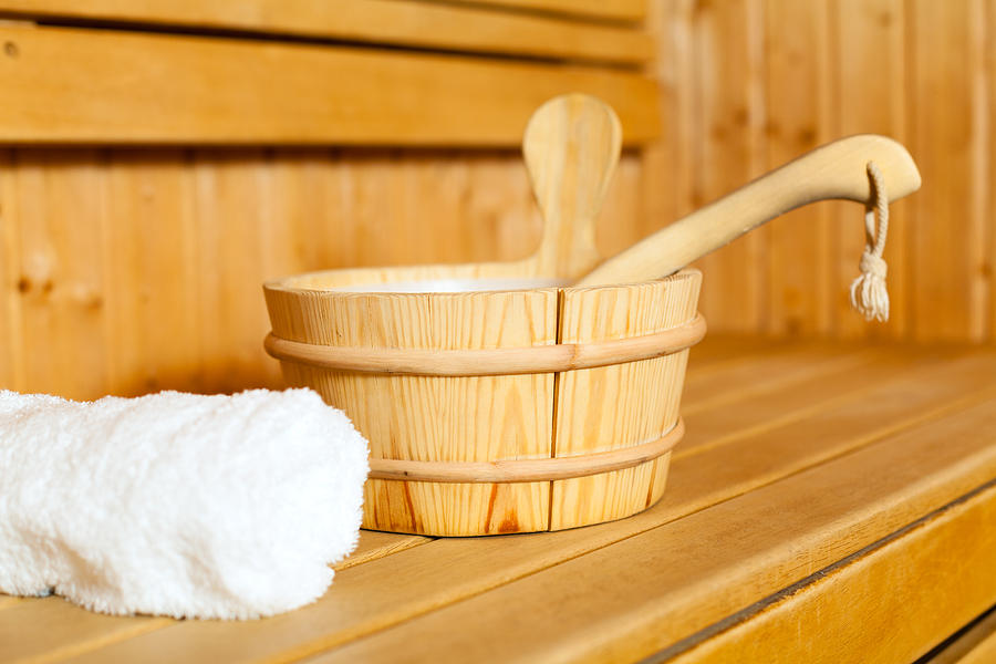 Close-up of towel, bucket and ladle in sauna Photograph by Fotostorm