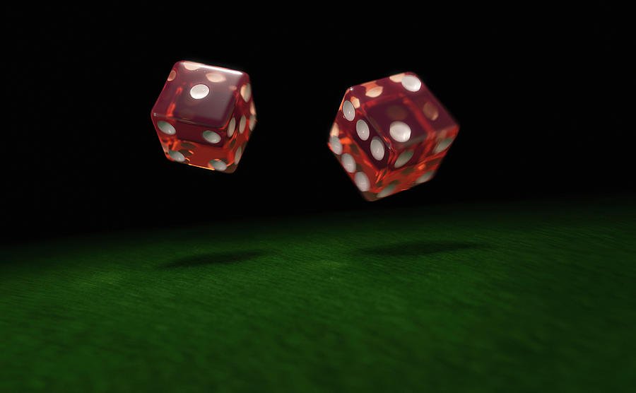 Close Up Of Two Rolling Dice Photograph by Ikon Images