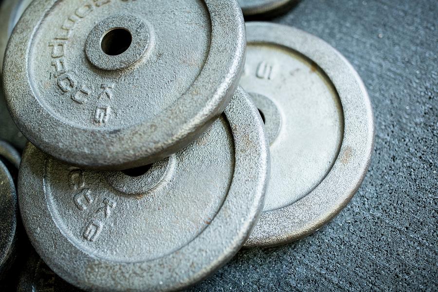 Close-up Of Weight Plates In Stack Photograph by Science Photo Library