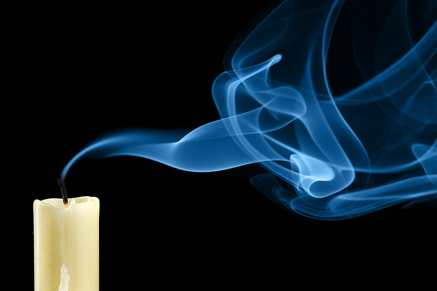Close-up of white extinguished candle with curling up smoke Photograph by Zoom-zoom
