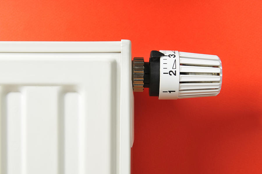 Close-up of white thermostat and radiator on red background Photograph by Domin_domin