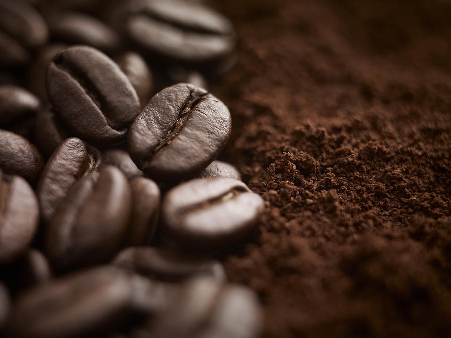 Close up of whole coffee beans and ground coffee Photograph by Adam Gault
