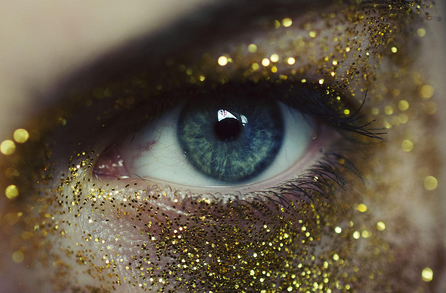 Close-up of woman eye with gold glitters Photograph by Rachelrabin