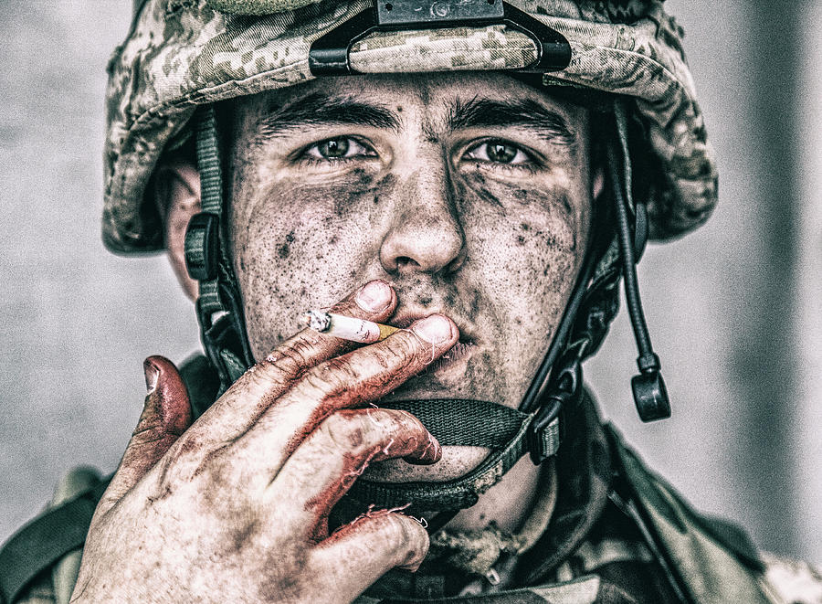 Close-up Portrait Of A Dirty Soldier Photograph by Oleg Zabielin