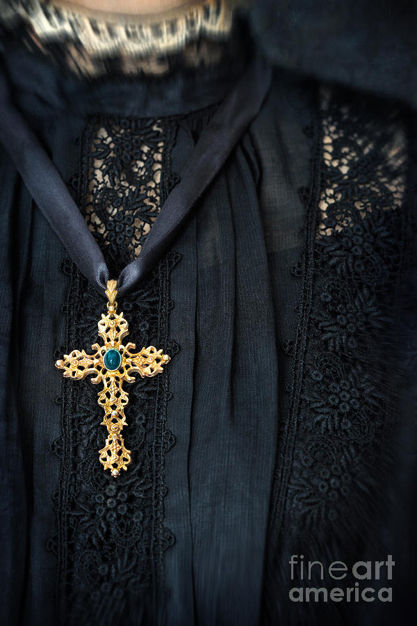 Closeup of cross necklace on black mourning dress Photograph by Sandra Cunningham